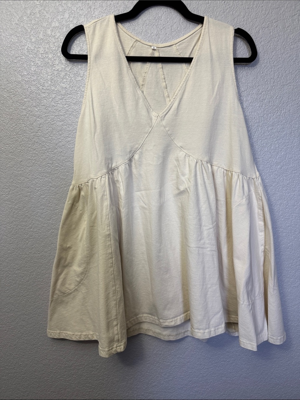 Sleeveless V-Neck Peplum Tank Top in Cream